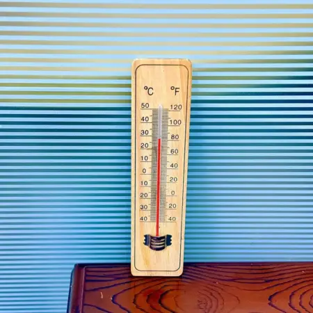 wooden thermometer with temperature scale for indoor use