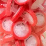 Laboratory Medical Syringe Filter jar with multiple pink sterile syringe filters for lab liquid filtration use