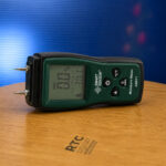 AS971 wood moisture meter display showing moisture percentage