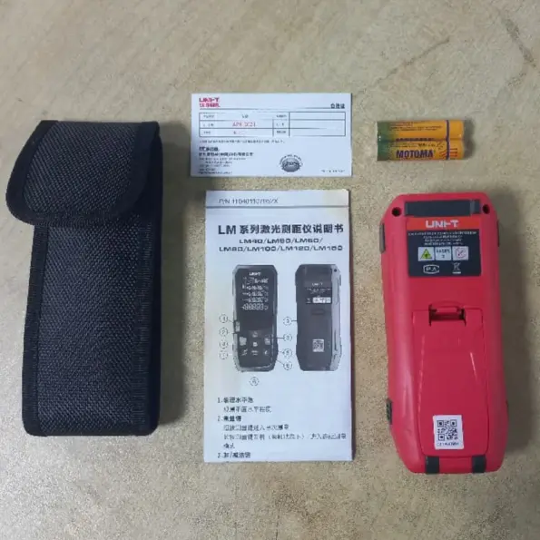 UNI-T LM-100 laser distance meter kit showing device, pouch, manual and AAA batteries for precise 100m measurement