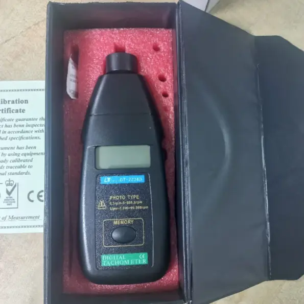 Digital tachometer DT-2234B photo type RPM meter in protective case for non-contact speed measurement.