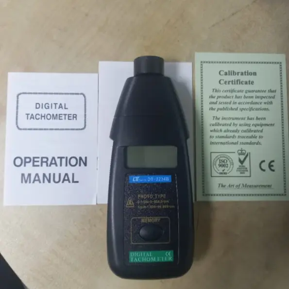 DT-2234B digital photo tachometer for non-contact RPM measurement, supplied in foam-lined carry case.