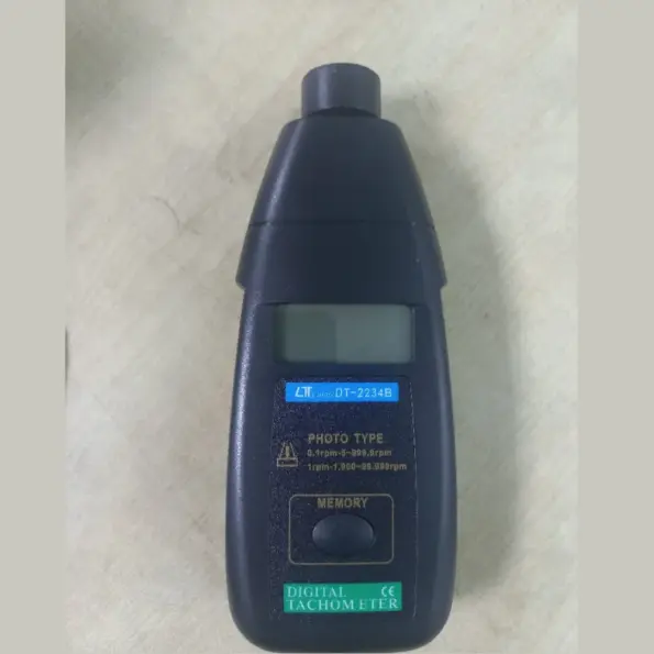 DT-2234B digital photo tachometer for non-contact RPM measurement, supplied in foam-lined carry case.
