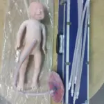 XC-409C advanced neonate simulator with umbilical cord and placenta for neonatal nursing training, cord clamping, cutting, and dressing practice.