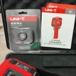 UNI-T UTi260B thermal imaging camera showing heat pattern on screen
