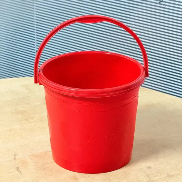 5 liter red plastic bucket with handle for household and cleaning use in Bangladesh