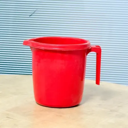 red plastic mouge jug 2.5L with handle and pouring spout for daily kitchen use in Bangladesh