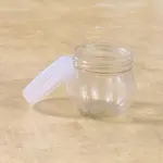 mini transparent plastic jar with white lid front view