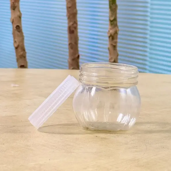 mini transparent plastic jar with white lid front view