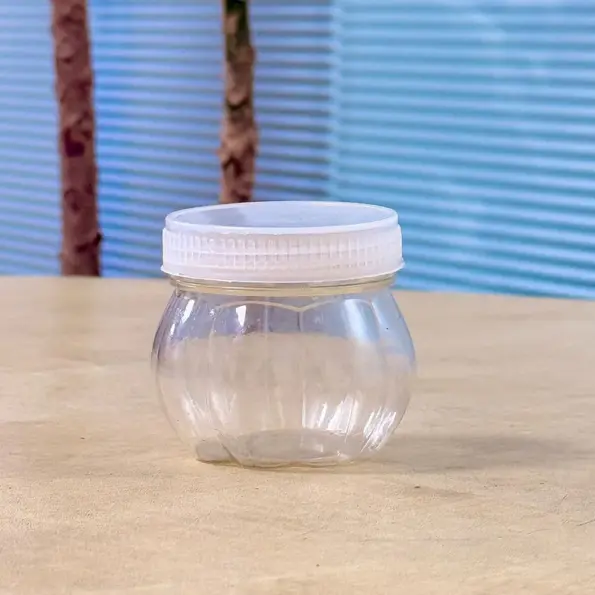 mini transparent plastic jar with white lid front view